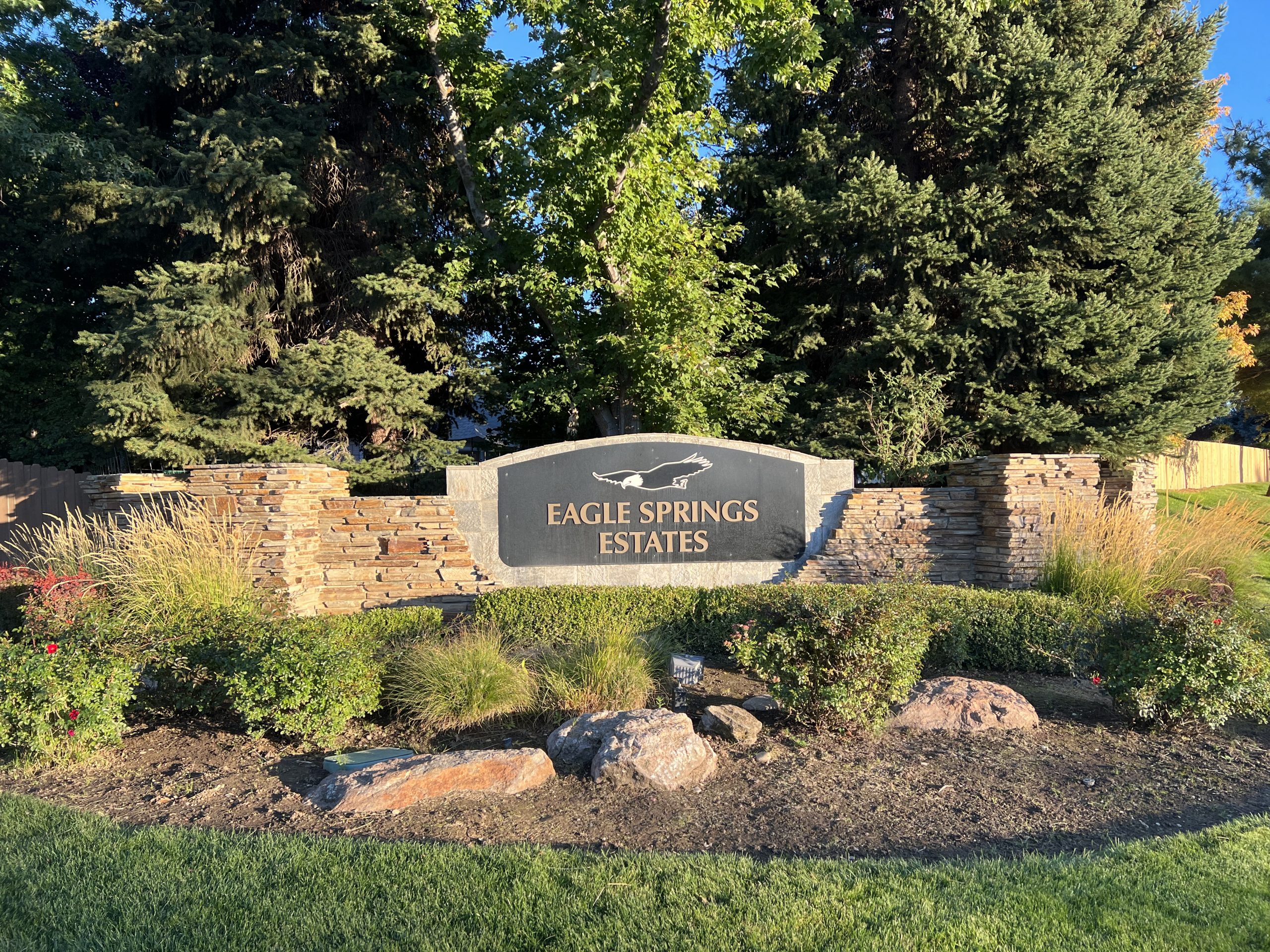 Stone and metal sign at entrance to the Eagle Springs subdivision.